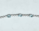 Blue Topaz And Diamond Accent Bracelet in sterling silver